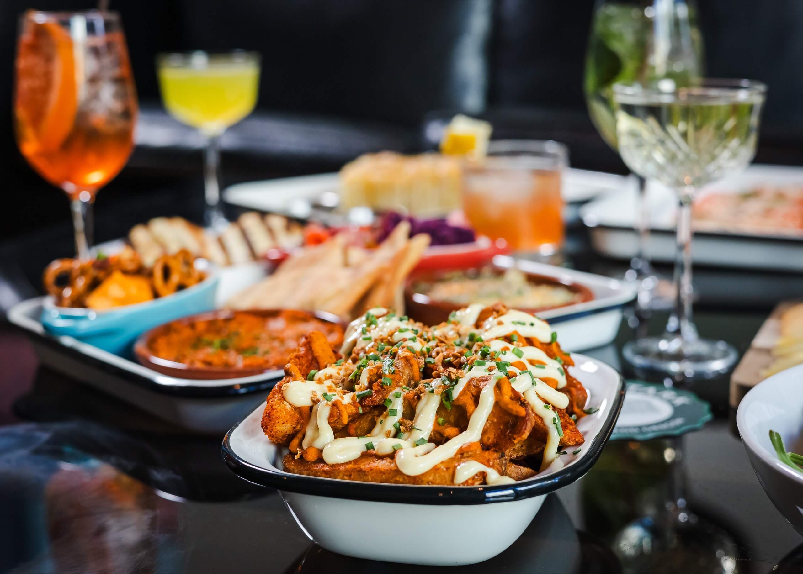 a table with a variety of food and drinks